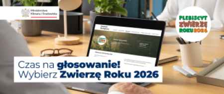 Grafika promująca głosowanie z motywem laptopa na biurku i logotypami akcji oraz organizatora.