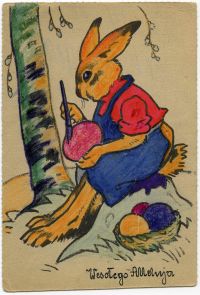 Barwna pocztówka z zającem malującym jajko.