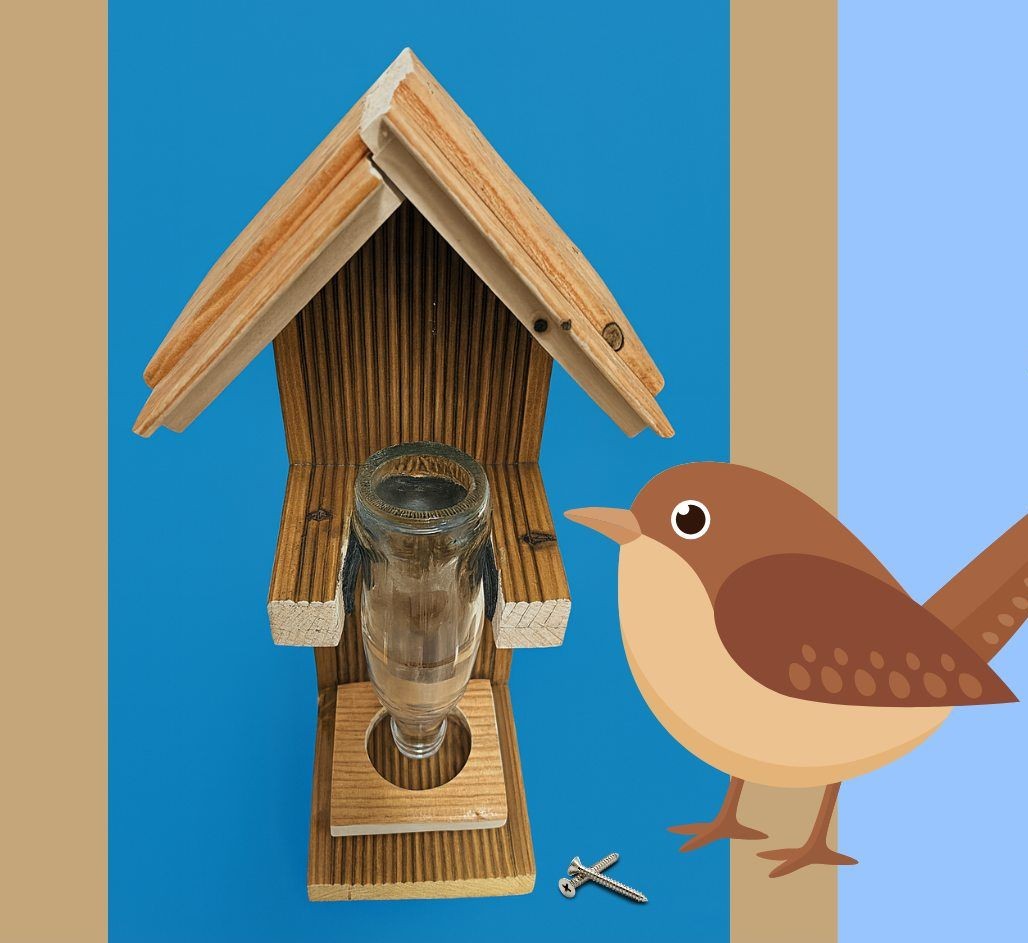 Ptaszek przy karmniku.