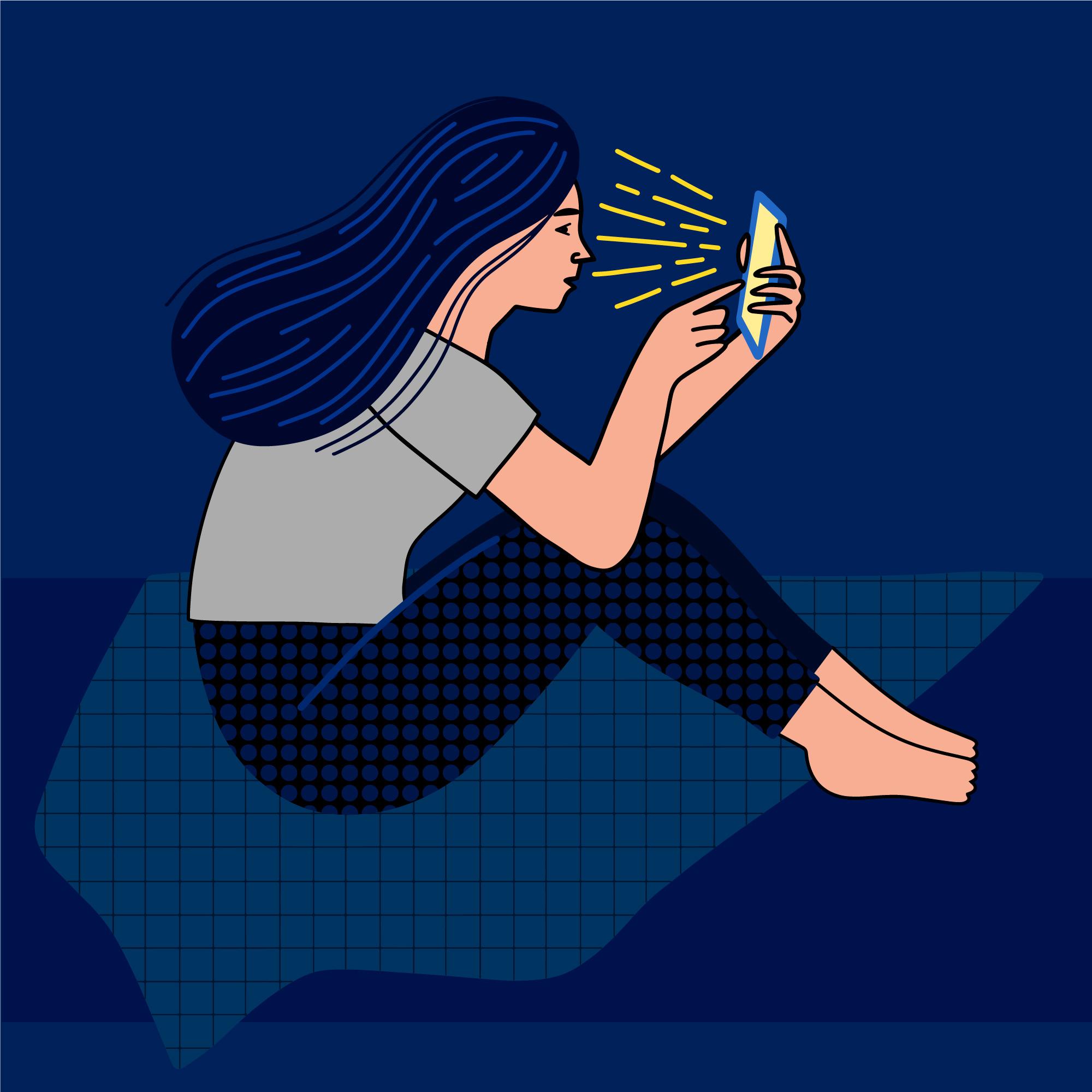 Smutna nastolatka w ciemnym pokoju patrzy na rozświetlony telefon.