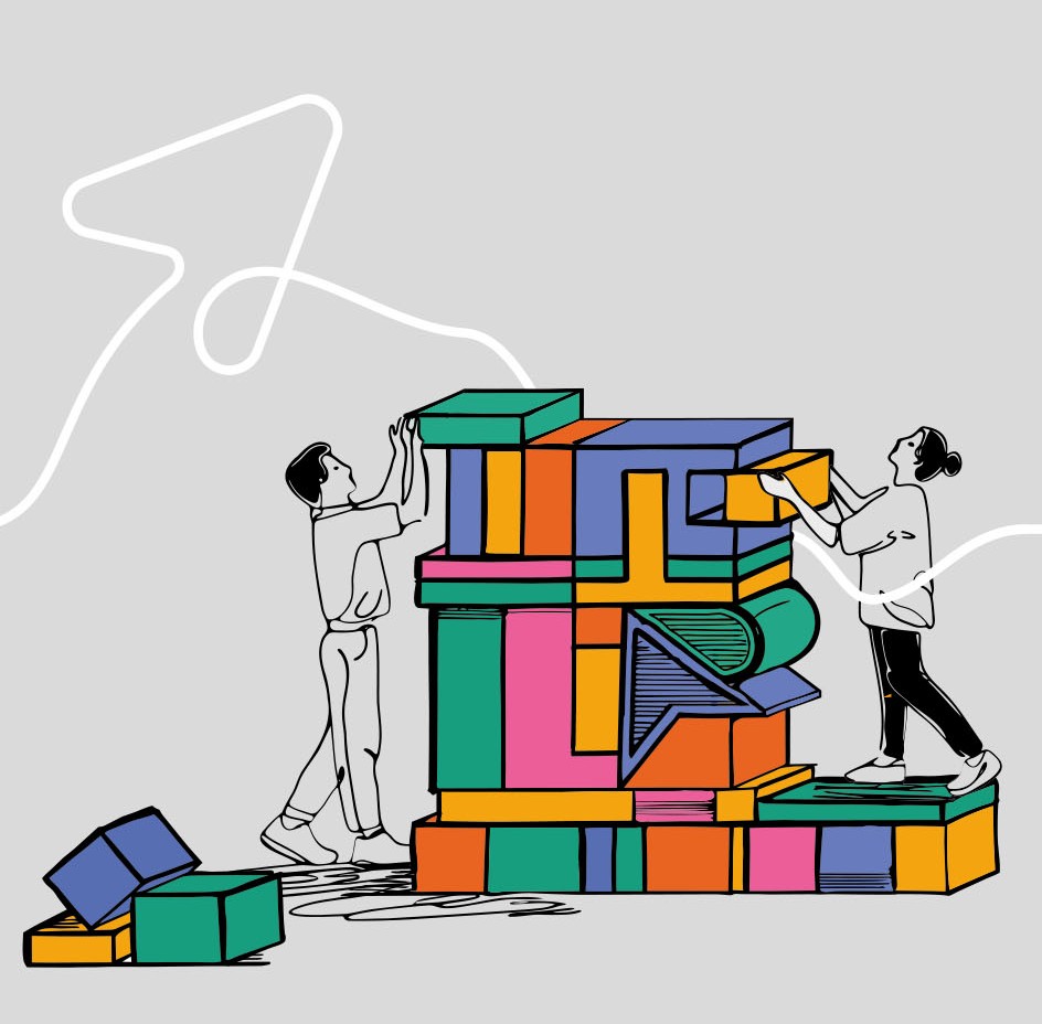 Kobieta i mężczyzna układający wieżę z dużych kolorowych klocków.