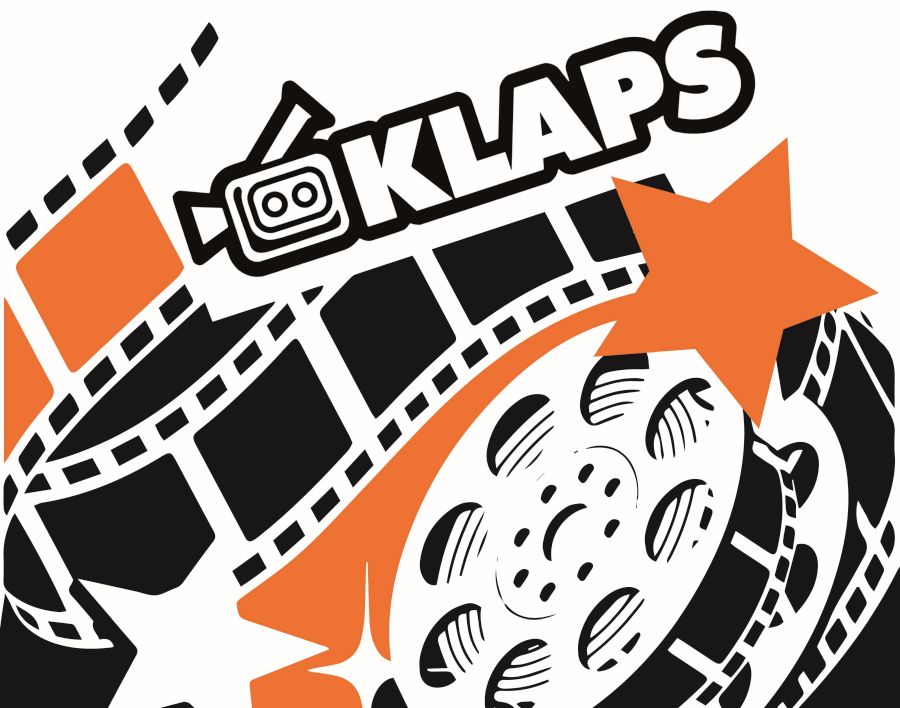 Kamera i taśma filmowa. Napis: Klaps.