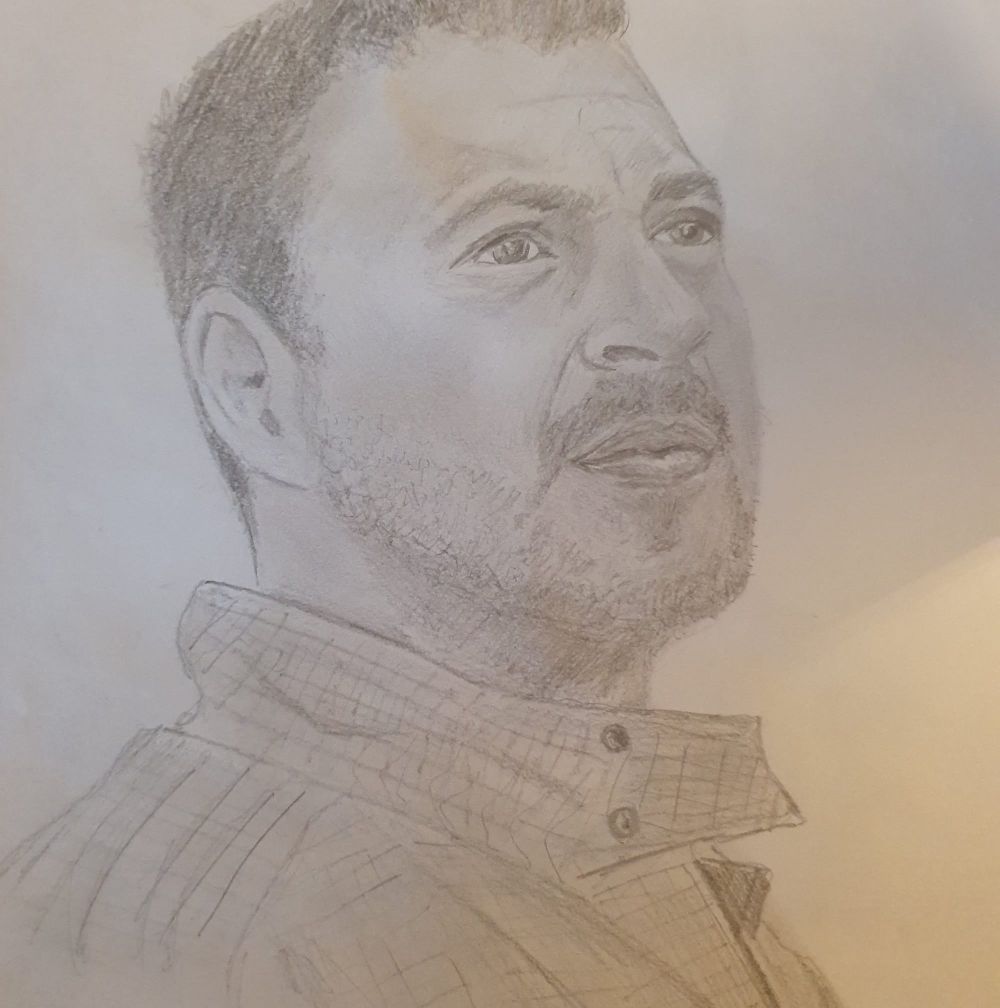 Portret mężczyzny wykonany ołówkiem.