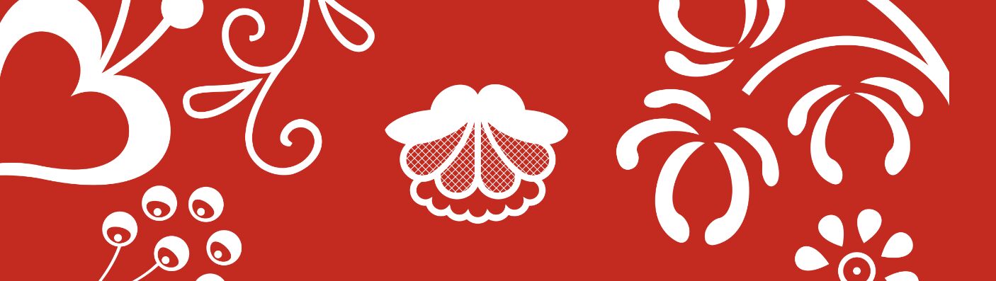 Roślinny motyw ludowy, biały na czerwonym tle.