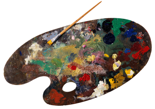 Paleta malarska z kolorowymi kleksami farb i pędzelkiem