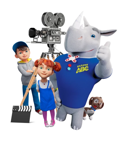 Nosorożec Rogatek, maskotka programu Kolejowe ABC oraz dziewczynka i chłopiec z kamerą filmową.